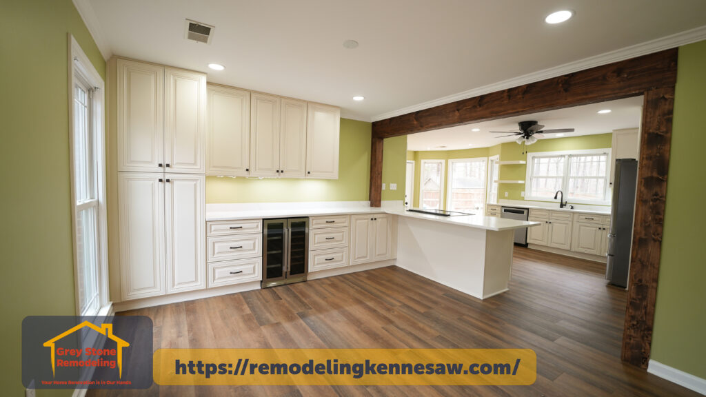 Fully Renovated kitchen with striking rustic wooden beam, custom cabinets, open space, and abundant natural light that maximizes natural light, creating a warm and modern atmosphere in Kennesaw