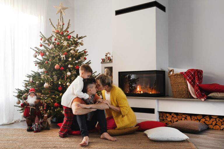 Happy family enjoying a remodeled fireplace for winter heating.