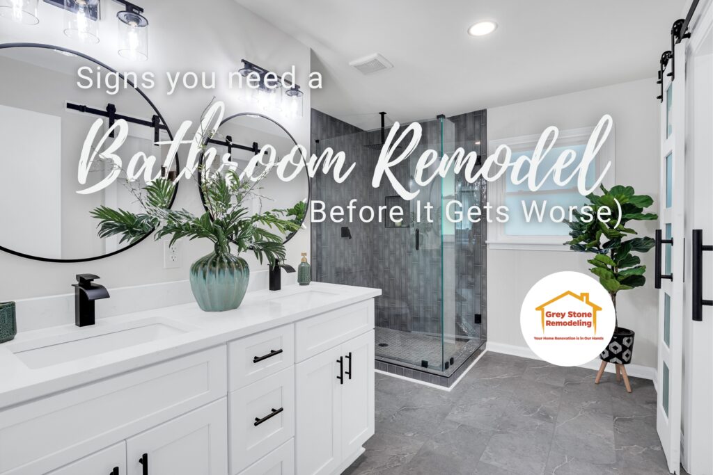 Modern master bathroom remodel with walk-in shower, white vanity, and stylish black fixtures — ideal example of signs you need a bathroom remodel.