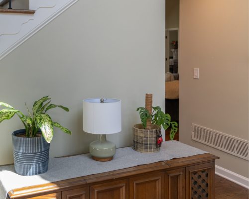 Interior wall painting with soft beige finish and clean edges under staircase – by Grey Stone Remodeling in Kennesaw